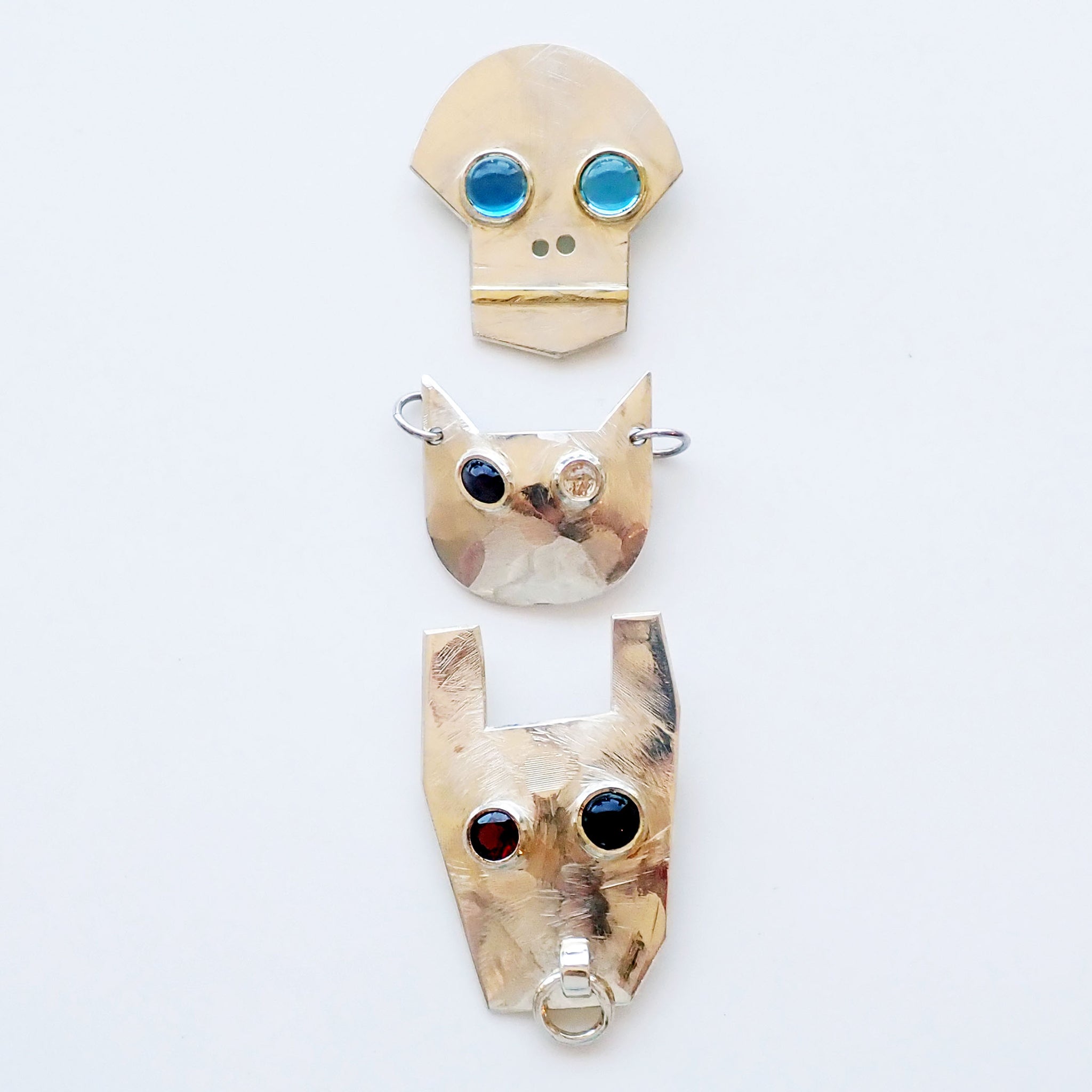 John Z. Robinson brooches